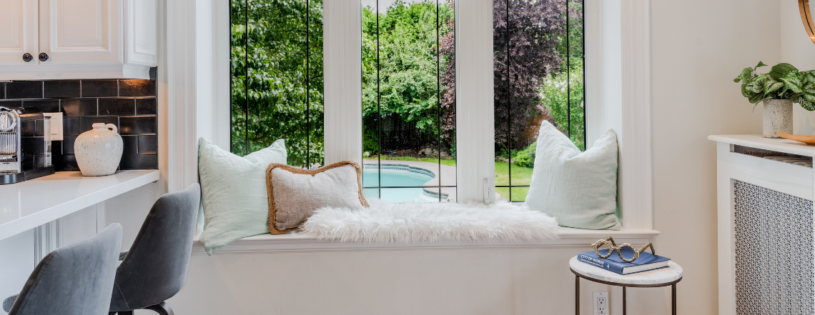 Room with large window showcasing pool